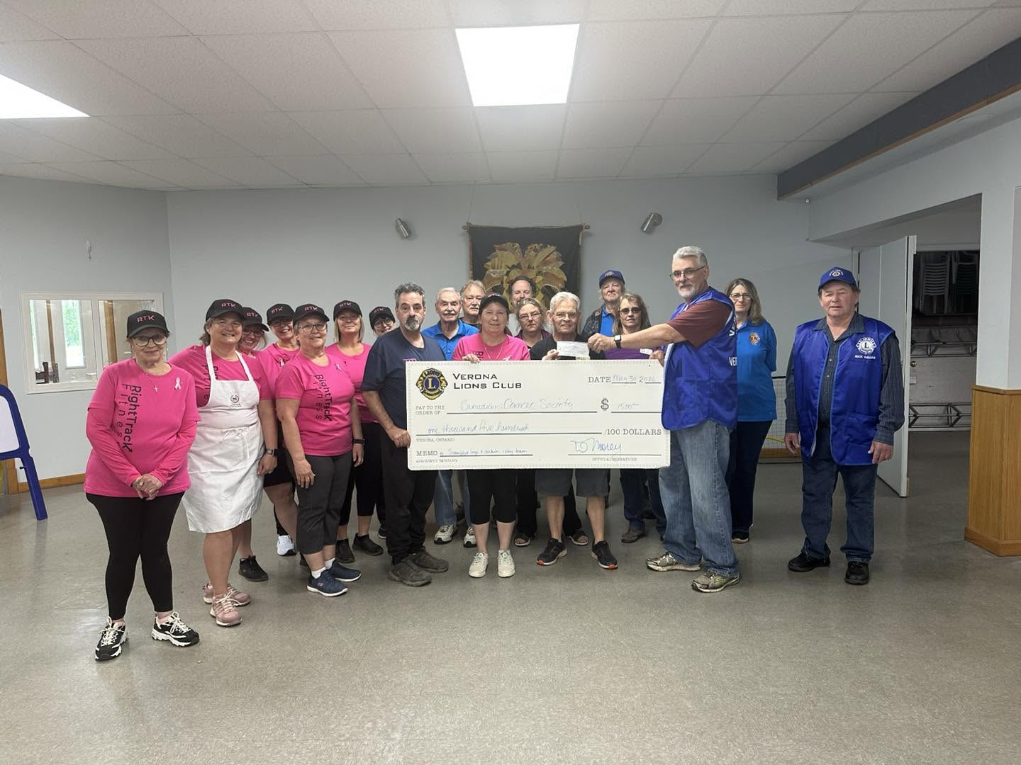 RightTrack Fitness community members at a donation presentation